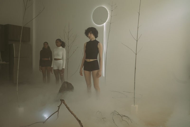 Performers in fog