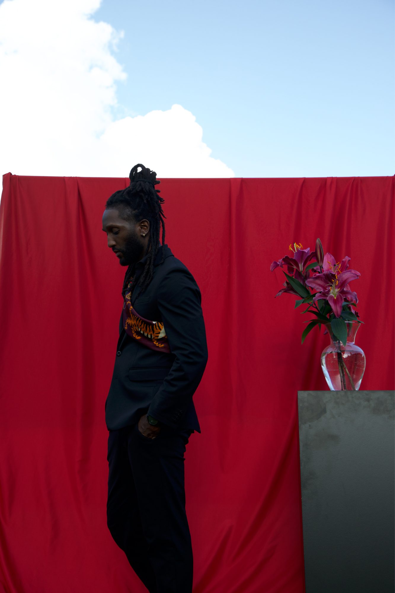 Shrodrick Spikes in profile against a red backdrop